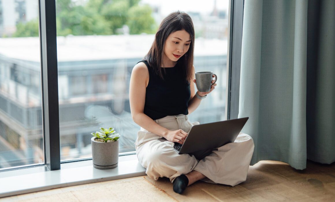Asian business woman working from home with laptop