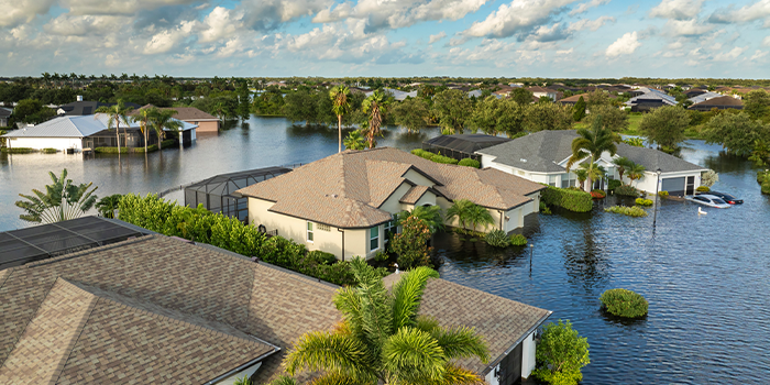 Suburb houses in a Florida residential community surrounded by flood waters.