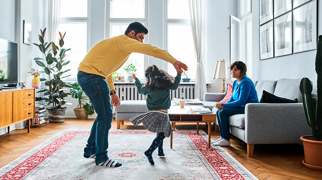 Employee family settling into furnished temporary housing as part of a corporate housing and relocation program review.